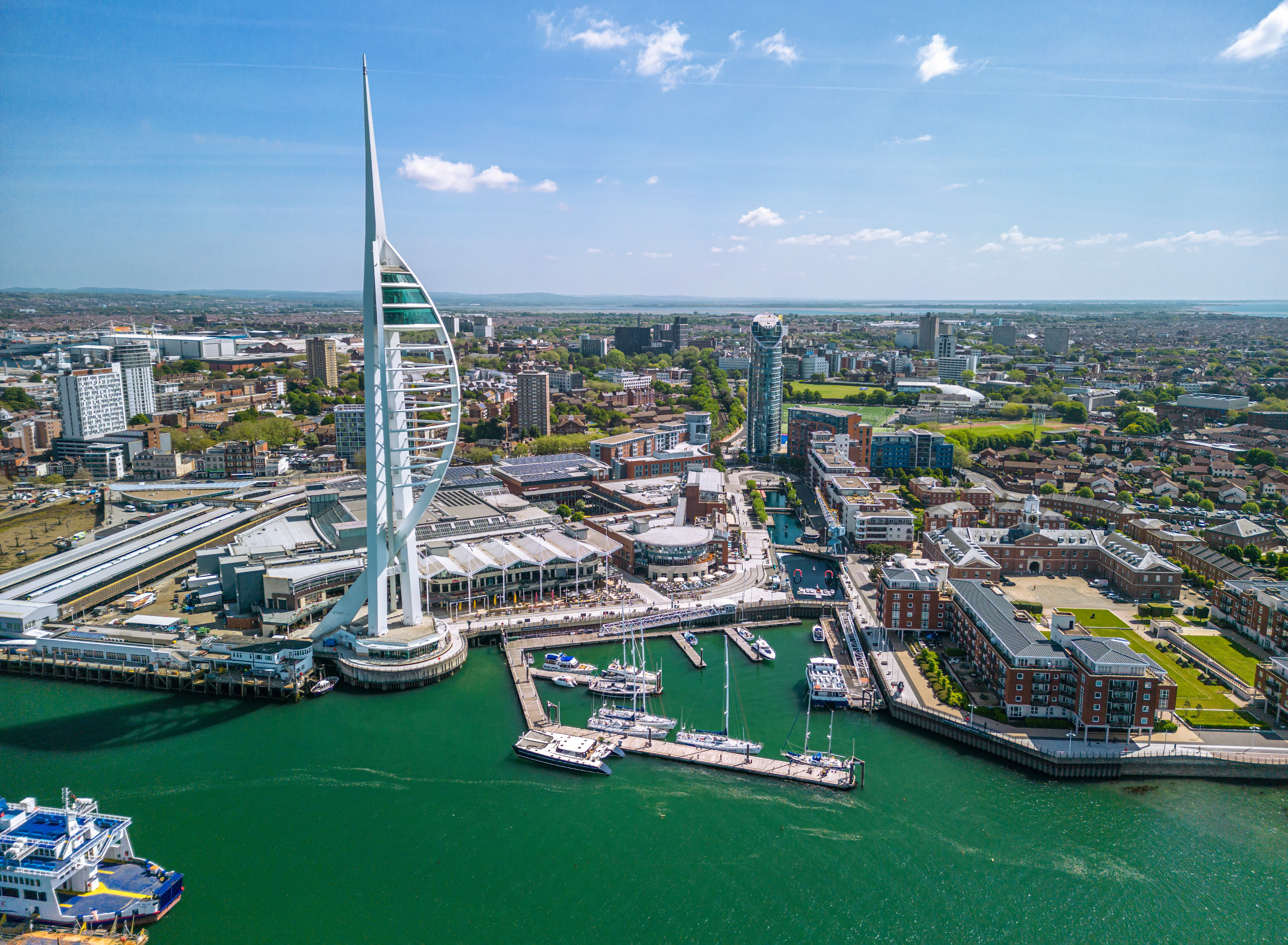 The drone aerial view of Spinnaker Tower and Portsmouth Harbour. Portsmouth is a port city and unitary authority in Hampshire, England.